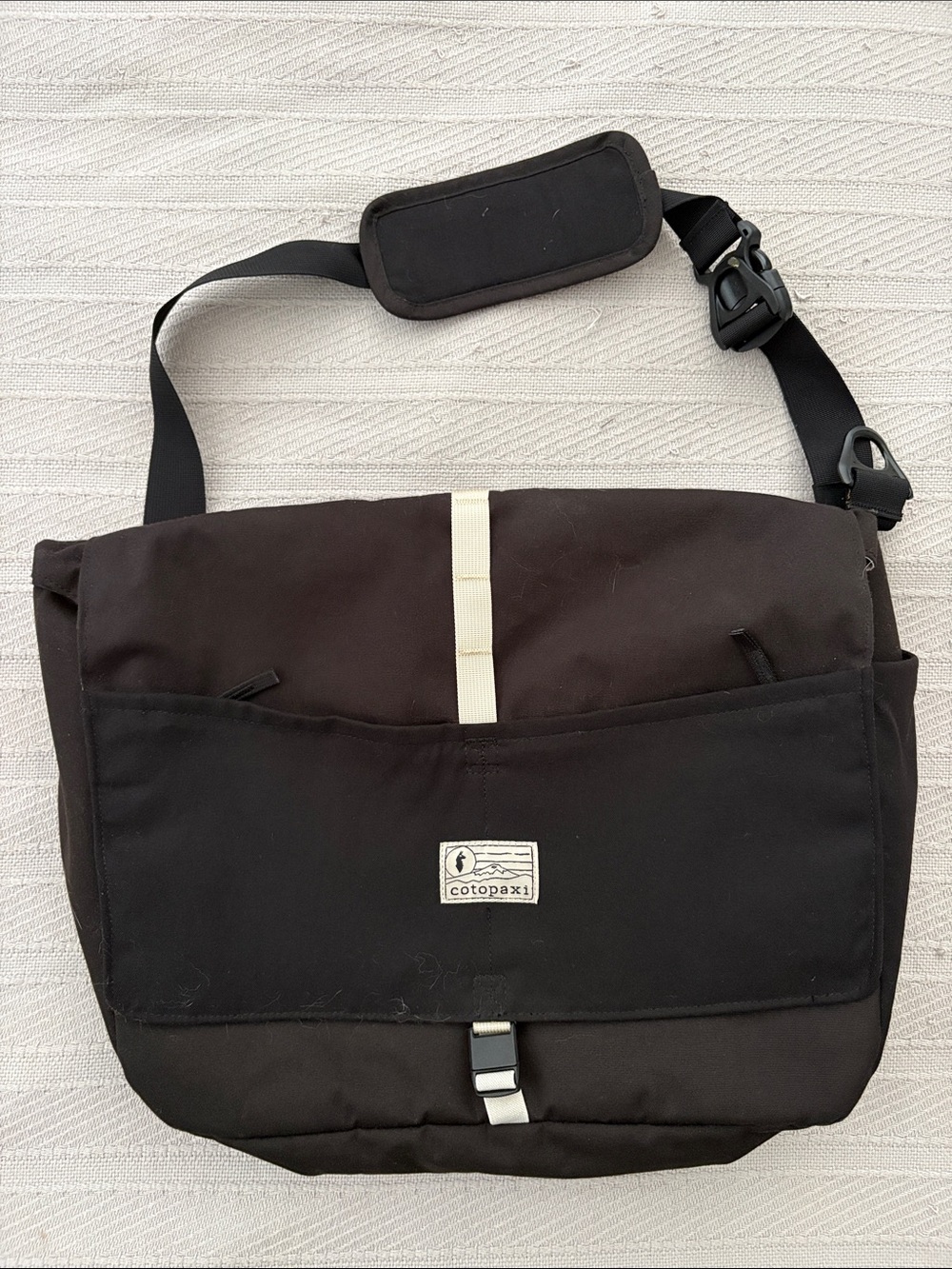 cotopaxi Black Messenger Bag with Cream Stripe